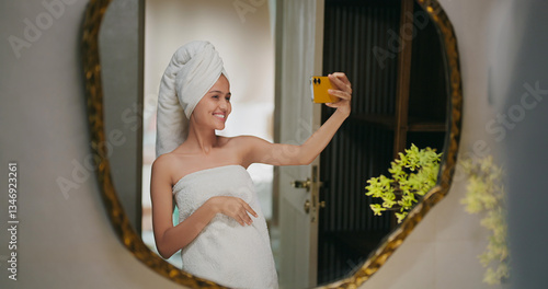 Photography Indian happy gen z young adult female lady wrapped towel head and body after sho