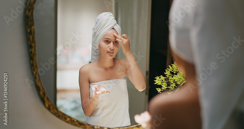 Obraz na plátně Indian young adult gen z woman lady wrapped towel on head and body look mirror a