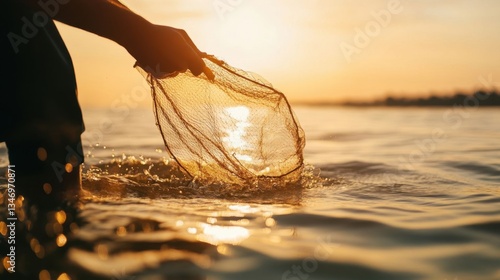Fisherman casting net at dawn.