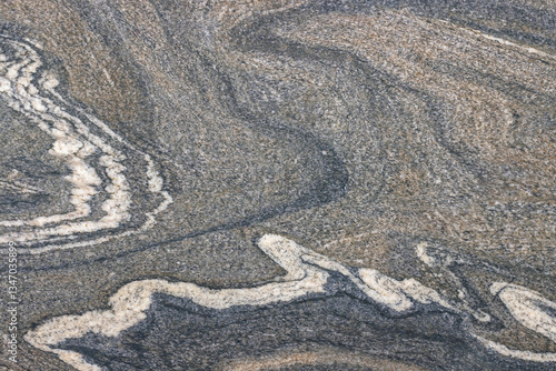 Obraz na płótnie Swirling patterns of textured rock display nature's artistry in muted tones of gray and white w salonie