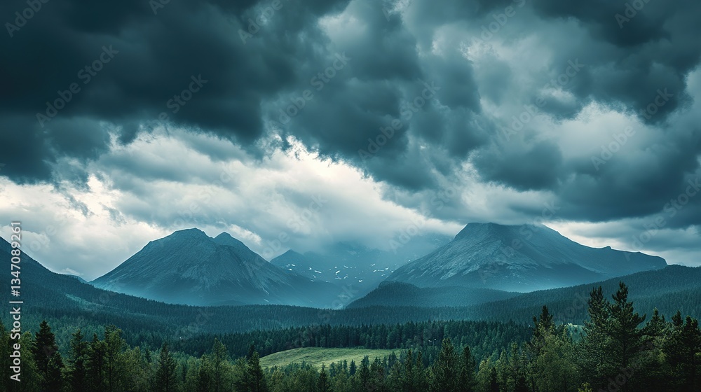 Fototapeta premium Dark storm clouds forming over a distant mountain range.