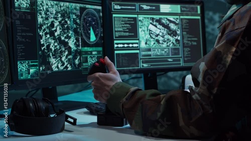 Military soldier operating advanced technology in a command center.