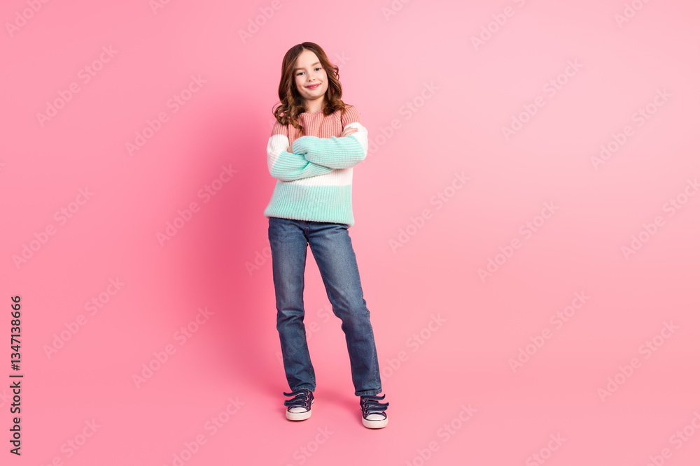 Stylish girl in casual pullover posing confidently against a pink background, showcasing trendy fashion with a cute and happy expression. Stylish girl in casual pullover posing confidently against a pink background, showcasing trendy fashion with a cute and happy expression.