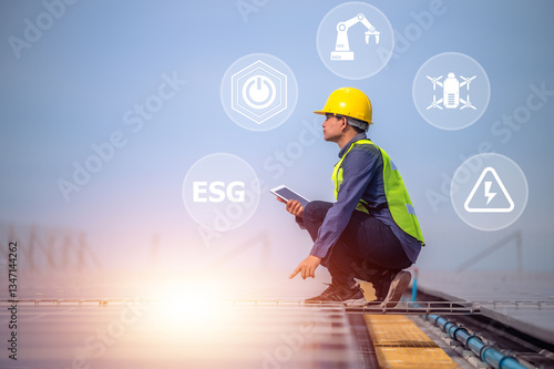 A solar energy engineer inspects photovoltaic panels using digital technology to drive a sustainable future with ESG standards.