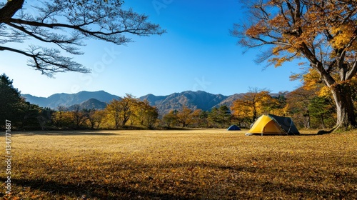 Autumn Camping Serenity: Mountains, Tent, and Golden Meadow