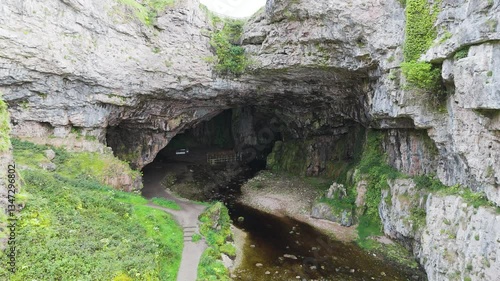 Smoo Cave in Scotland is a dramatic sea cave carved into limestone cliffs, where a waterfall thunders into darkness. A place of mystery, natural wonder, and ancient legends shaped by sea and time