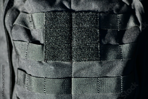 Bild auf Leinwand Close-up image of black velcro strips on a black tactical military backpack