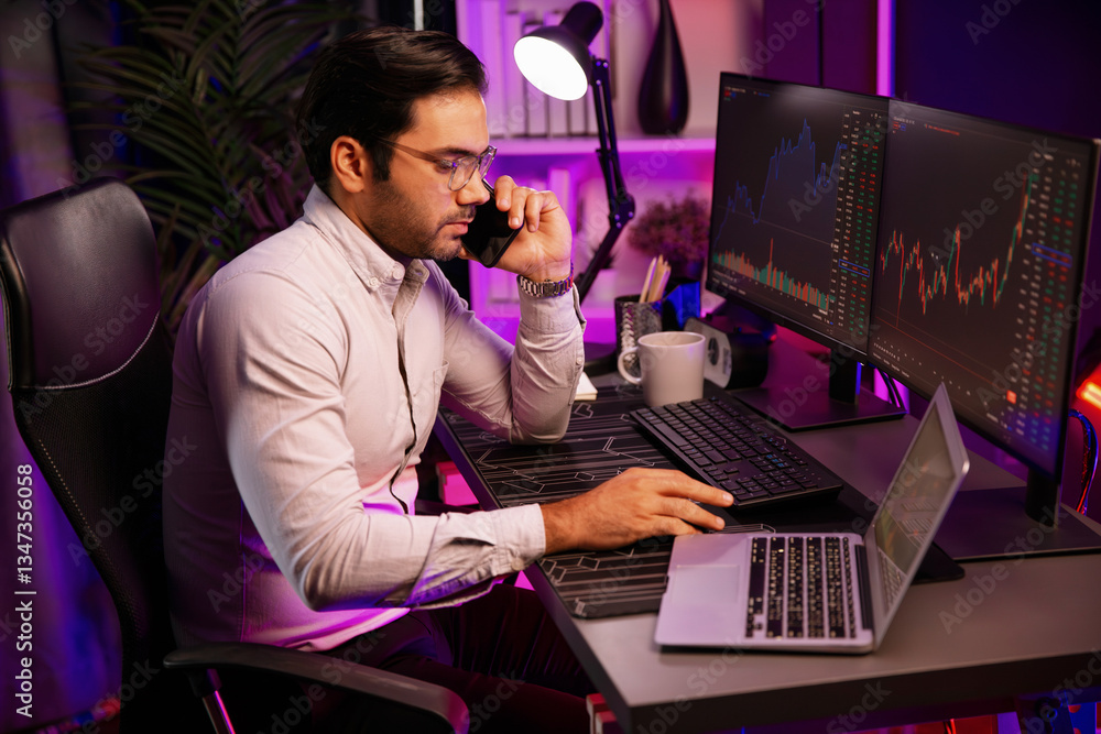 Trader smart businessman calling to broker or partner, analyzing in dynamic stock exchange investment on pc at neon lighting office with invest profitable financial technology at modern home. Surmise. Trader smart businessman calling to broker or partner, analyzing in dynamic stock exchange investment on pc at neon lighting office with invest profitable financial technology at modern home. Surmise.