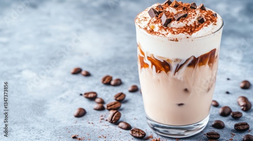 Wallpaper Mural Chilled Coffee Delight: A refreshing iced coffee layered with rich textures, adorned with whipped cream and chocolate shavings, and accented with scattered coffee beans on a textured surface. Torontodigital.ca