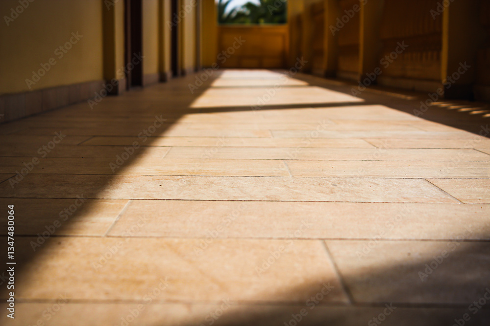 low angle stone tile flooring close-up of an outdoor walkway or breezeway architectural linear perspective background low angle stone tile flooring close-up of an outdoor walkway or breezeway architectural linear perspective background