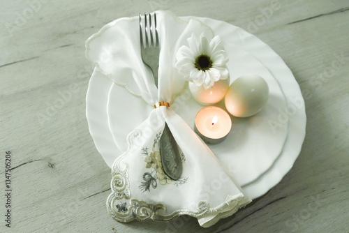 Easter still life with eggs, candle and flower