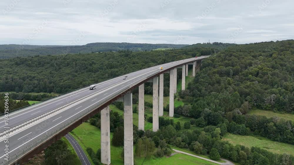 Flight over highway beam bridge Grenzwaldbrücke with panorama of valley of river Schmale Sinn in Rhön Mountains, Germany Flight over highway beam bridge Grenzwaldbrücke with panorama of valley of river Schmale Sinn in Rhön Mountains, Germany