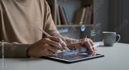 Professional using tablet to analyze data and create visual charts in a modern office setting