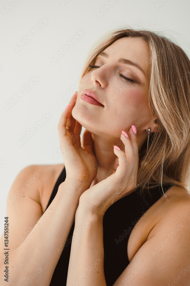 This elegant portrait captures a womans inner serenity and grace, showcasing her calm demeanor and chic style, which exude confidence and elegance against a minimalistic backdrop This elegant portrait captures a womans inner serenity and grace, showcasing her calm demeanor and chic style, which exude confidence and elegance against a minimalistic backdrop