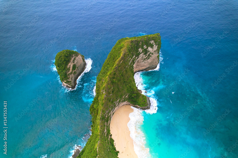 Cinematic aerial landscape shots of the beautiful island dinosaur of Nusa Penida. Huge cliffs by the shoreline and hidden dream beaches with clear water.