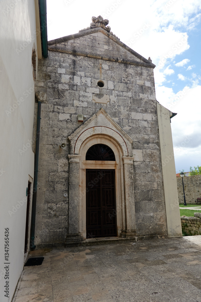 Nin, Croatia - September 13, 2024 - historic city center of a Mediterranean town. Houses, ruins and churches bear witness to a long history.
