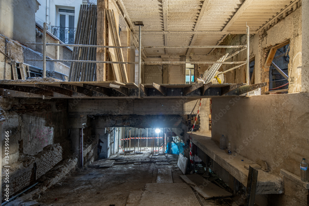 Multilevel building renovation with exposed structure and scaffolding Multilevel building renovation with exposed structure and scaffolding