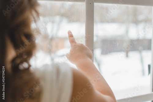 Little girl looking out window Free Download Little girl looking out window - GFXLoad
