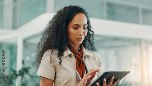 Business woman, tablet and online in office for editing fashion magazine, catalog or app. Digital technology, internet and worker research design trends, schedule or reading email in creative startup