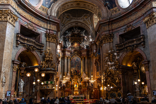 Fototapeta Tourists admiring the opulent interior of St