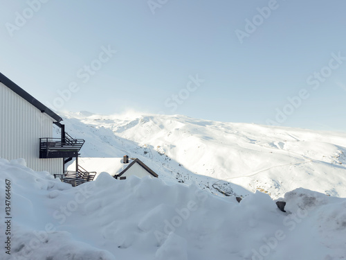 Snow covering ski resort houses and mountains in winter