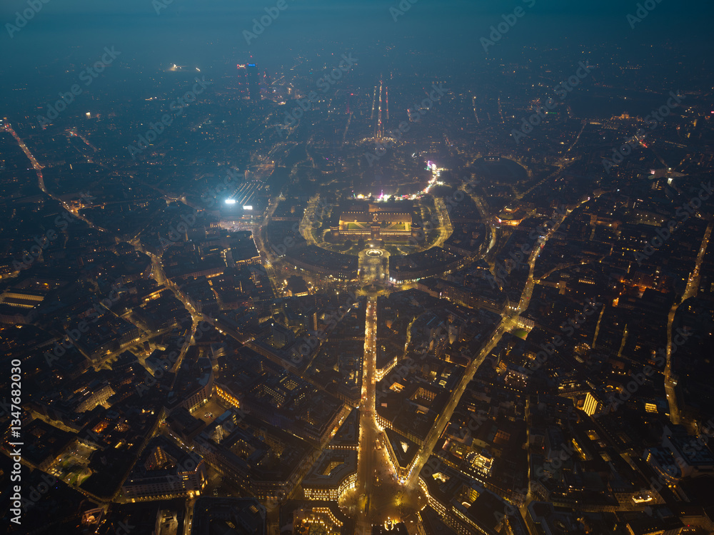 Obraz premium Night aerial drone view of the illuminated Castello Sforzesco in Milan