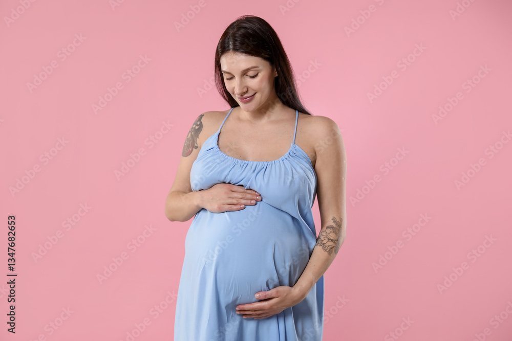 Beautiful pregnant woman with cute belly on pink background Beautiful pregnant woman with cute belly on pink background