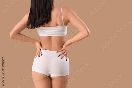 Young woman in white underw...