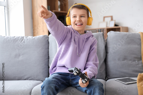 Teenage boy in headphones w...
