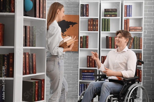 Male graduate in wheelchair...