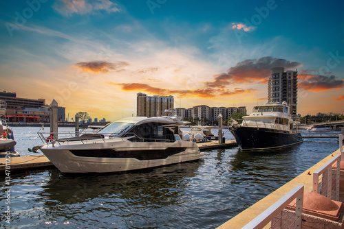 Boats and yachts docked on the Hillsborough River along the Tampa Riverwalk in Tampa Florida USA