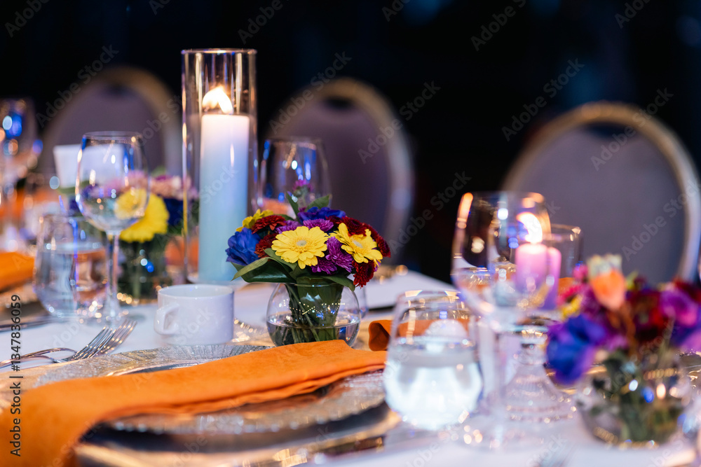 Elegant dinner table setting with candles and flowers