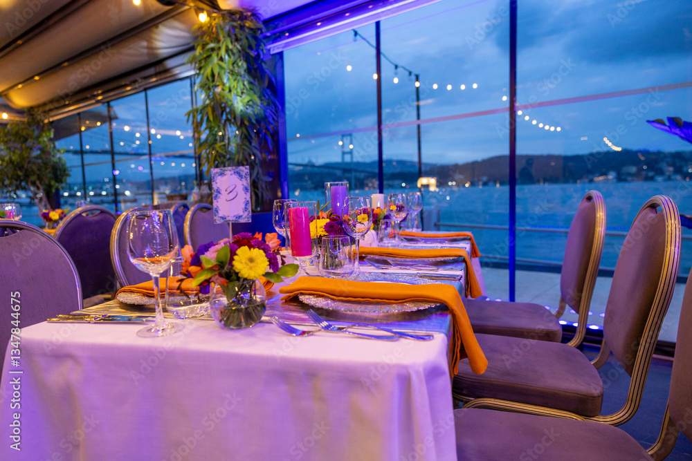 Luxury wedding dinner with city lights backdrop