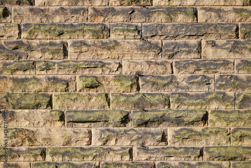 old rough pitch faced stone wall