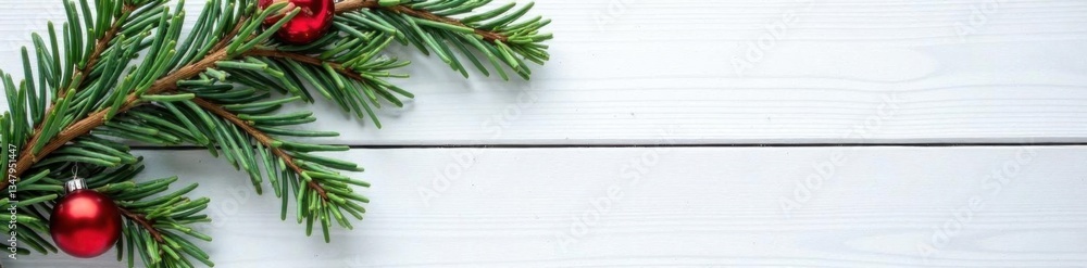 Obraz premium Fir branches on wooden white board with snowfall in festive background, peaceful , festive, New Year