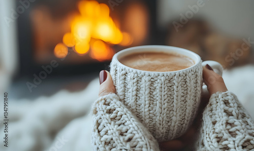 Wallpaper Mural Cozy Winter Warmth: Enjoying a Hot Beverage by the Fireplace at Home Torontodigital.ca