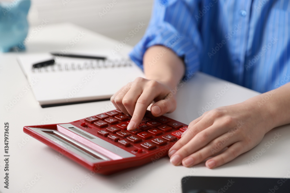 Budget. Woman with paperwork and calculator at white desk indoors, closeup Budget. Woman with paperwork and calculator at white desk indoors, closeup