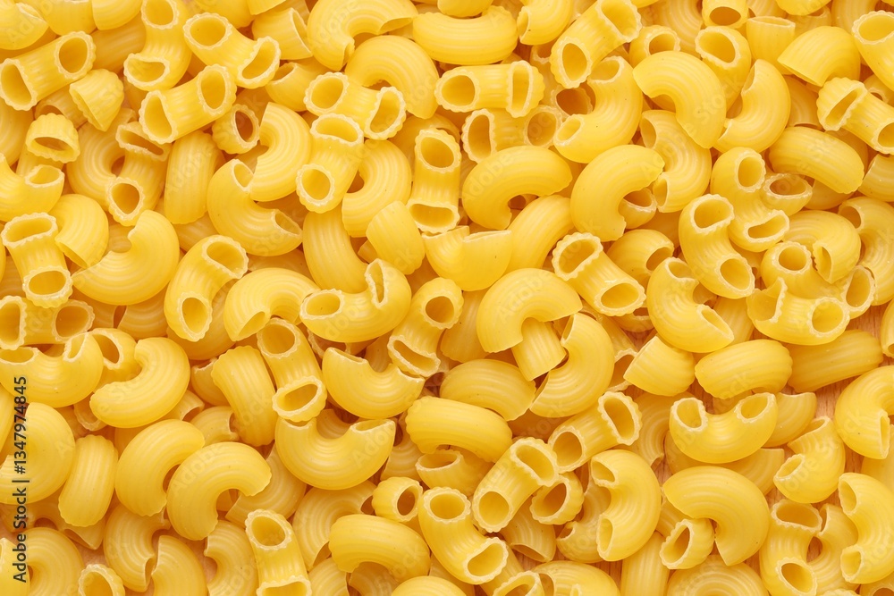 Raw horns pasta as background, top view Raw horns pasta as background, top view
