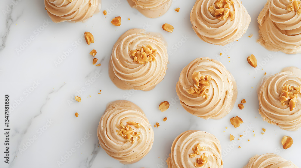 An Elegant Setup of Peanut Butter Swirl Ice Cream on a Marble Surface with Crushed Nuts Decor An Elegant Setup of Peanut Butter Swirl Ice Cream on a Marble Surface with Crushed Nuts Decor