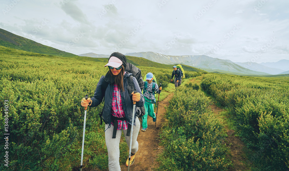 Mother and two children backpacking in the wild. Nowadays, it’s a great way to get children to really disconnect from technology and get back to basics. Great alternative to standard family vacation. Mother and two children backpacking in the wild. Nowadays, it’s a great way to get children to really disconnect from technology and get back to basics. Great alternative to standard family vacation.