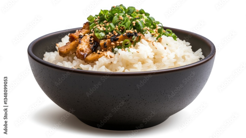 Asian-style rice dish, topped with chicken and herbs, on a dark bowl, against white background Asian-style rice dish, topped with chicken and herbs, on a dark bowl, against white background