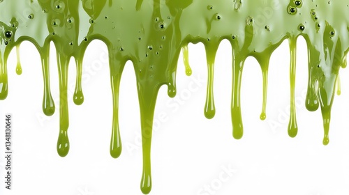 Thick green slime dripping down against a white background. Versatile for depicting Halloween, sci-fi, or gross-out themes. photo