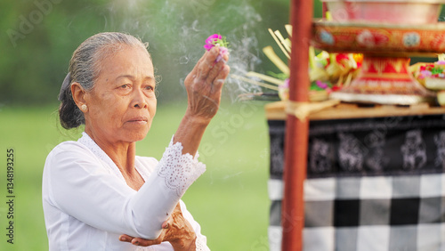 balinese woman praying at temple, offerings and incense, bali prayer, Indonesian culture, people