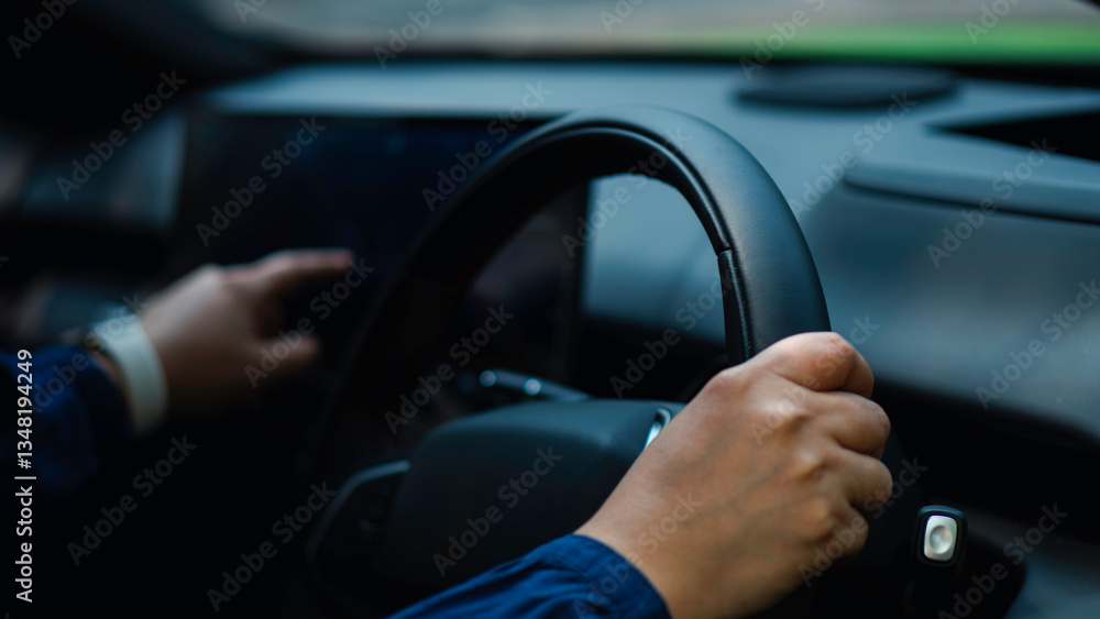 A driver grips the steering wheel of a electric vehicle while interacting with the touchscreen interface, smart car technology and the future of mobility. innovation, automation, and user-friendly. A driver grips the steering wheel of a electric vehicle while interacting with the touchscreen interface, smart car technology and the future of mobility. innovation, automation, and user-friendly.
