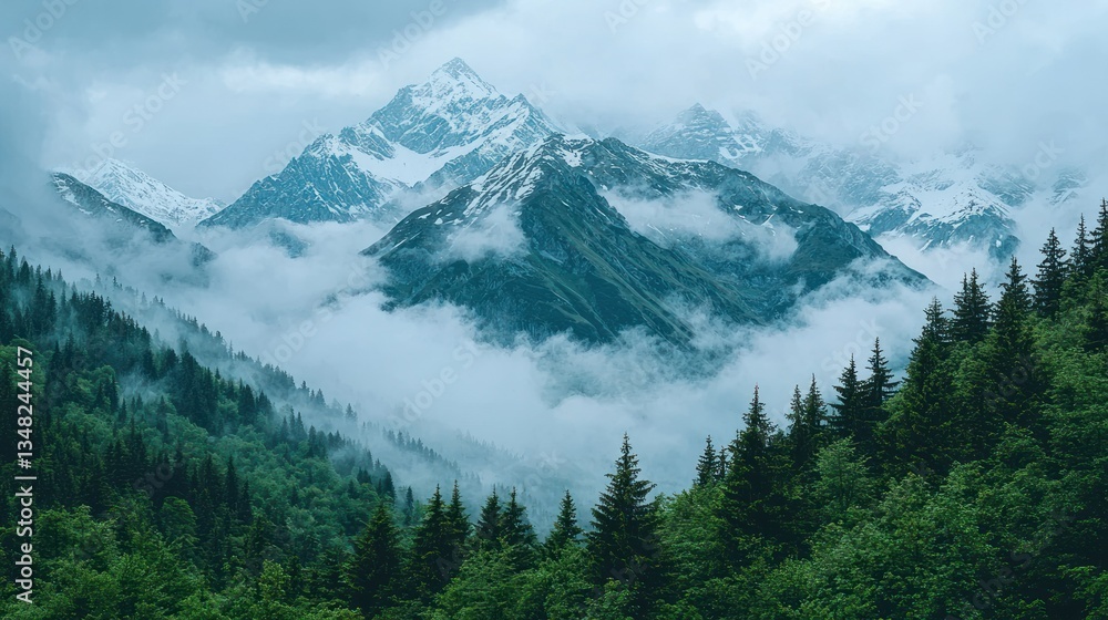 Fototapeta premium Mountain peaks rise above the foggy forest, capped with snow. Dreamy view
