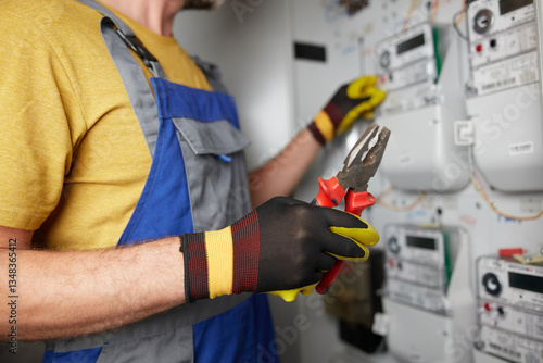 Obraz na płótnie Technician working on a modern electricity power meter station in a building. w salonie