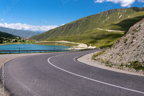 A sharp turn on a mountain road. The serpentine. Car winding road in beautiful mountains. Caucasus. The Chechen Republic, Russia