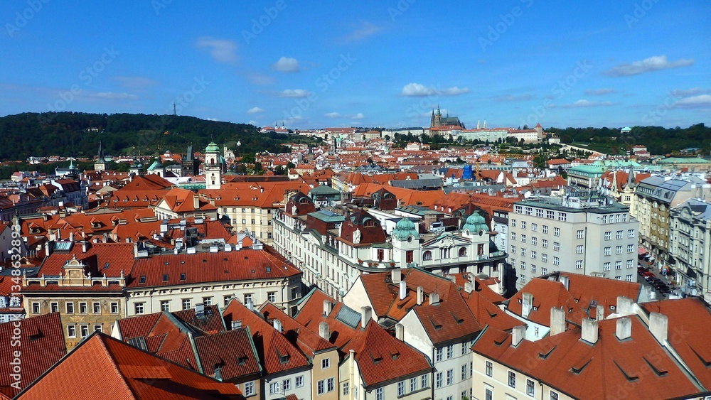 Obraz premium View of the city of Prague and old town square with buildings and St. Nicholas church seen from the Old Town Hall (Staromestska Radnice)