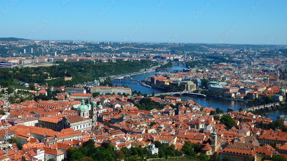Fototapeta premium View of Charles bridge across Vltava river and the Prague castle complex on a sunny day in Prague, Czech Republic