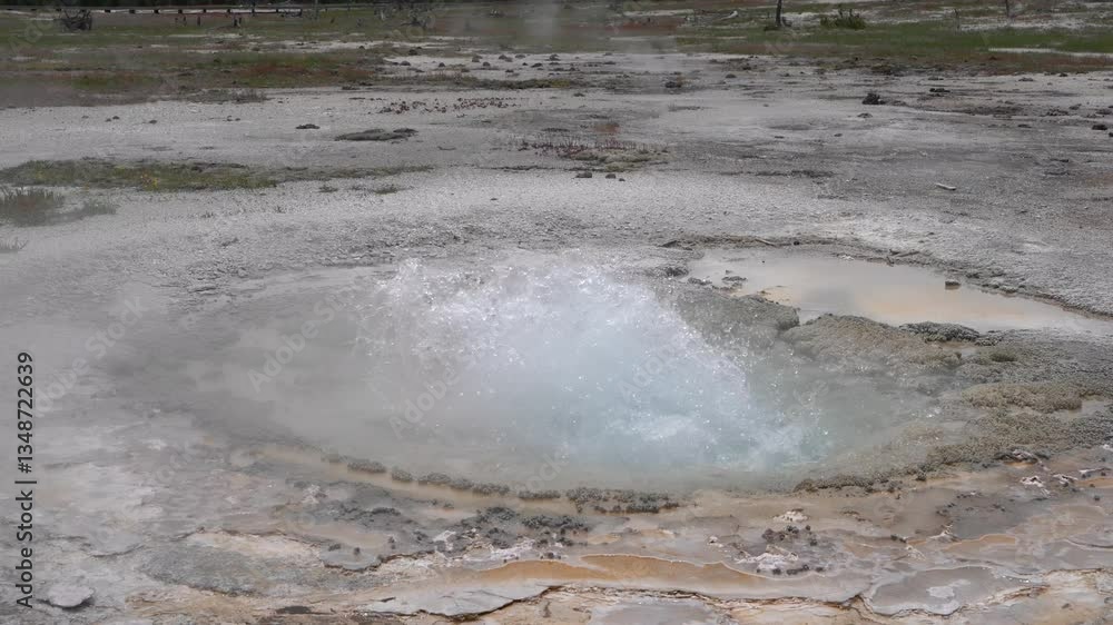 Active, Bubbling, Hot Springs Geyser Splashing Hot Water And Steam. 4K Tourist POV Visiting Yellowstone National Park, USA. Active, Bubbling, Hot Springs Geyser Splashing Hot Water And Steam. 4K Tourist POV Visiting Yellowstone National Park, USA.